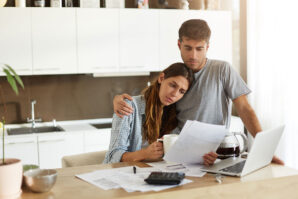 couple stressed out over bills and delaying bankruptcy